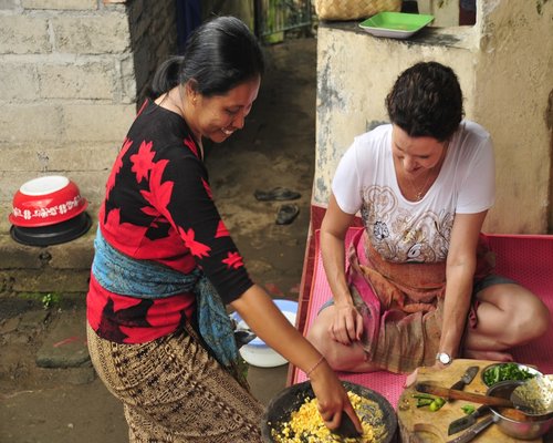 Local Indonesian family preparation of a traditional balanced lunch with fresh home cooked food options